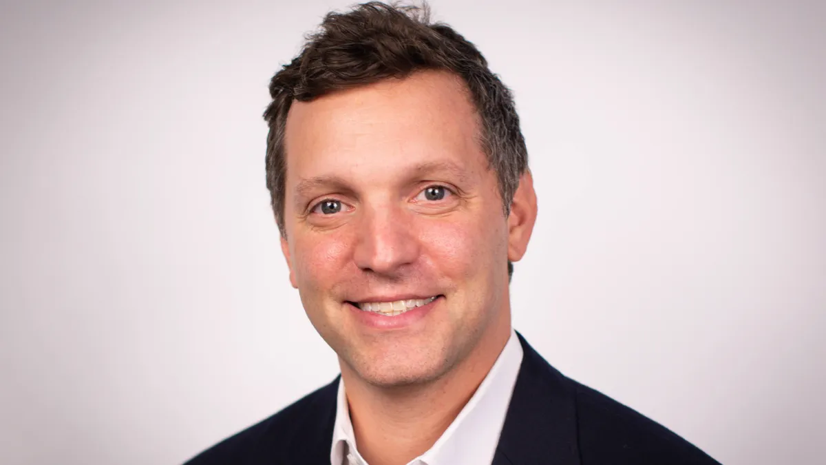 A photograph of Scott Gladstone, Dine Brands international president and chief development officer