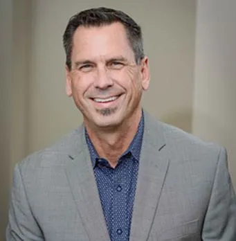 Headshot of man in a suit jacket