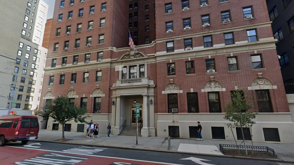 A tall, brick apartment building in New York City.