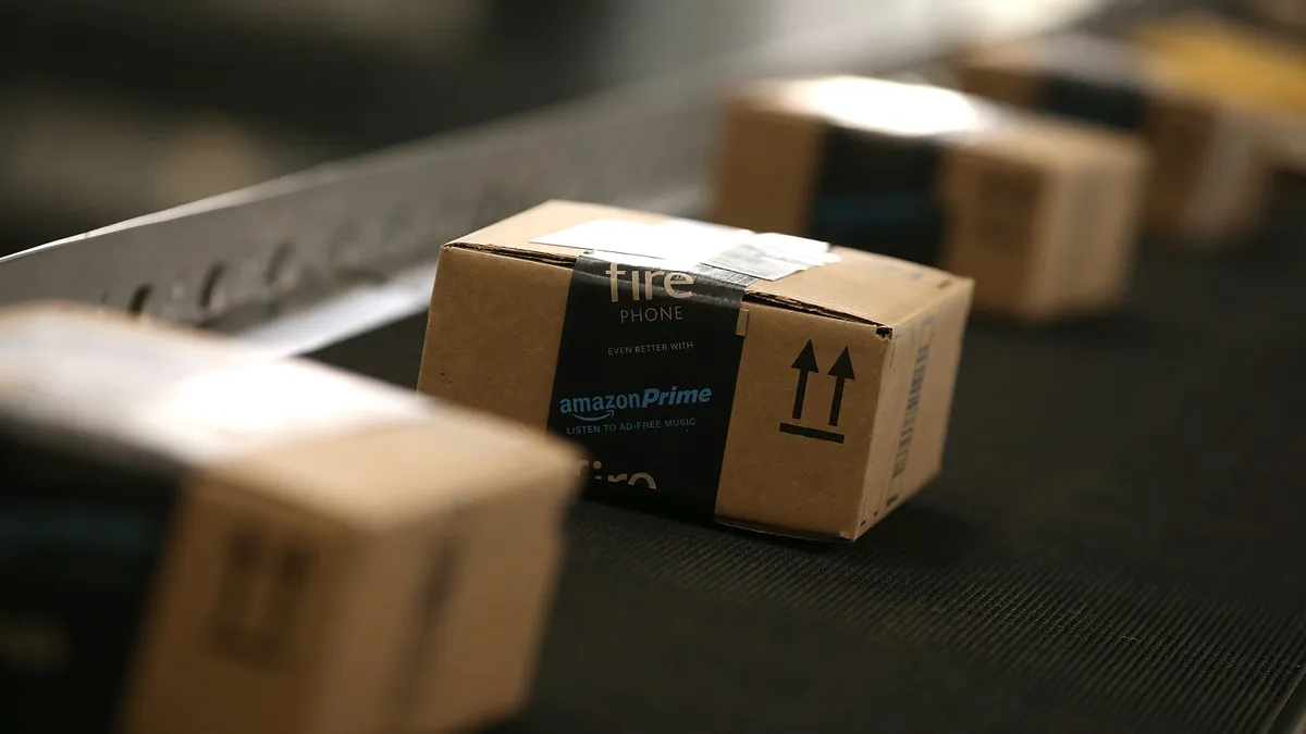 Boxes move along a conveyor belt at an Amazon fulfillment center