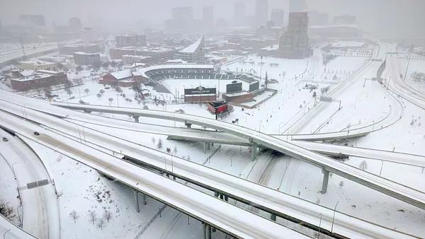 An aerial view shows a stadium and interstate roads covered in snow in January 2026 in Louisville, Kentucky,