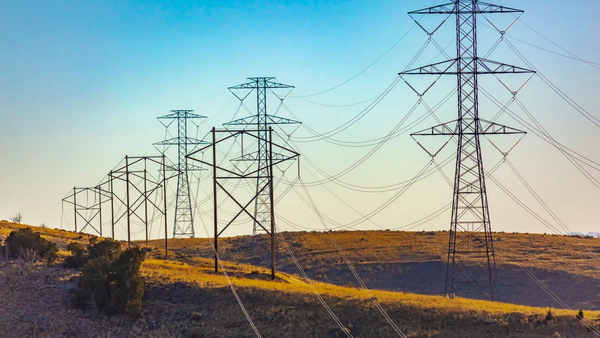 Electrical towers trailing far into the distance in Utah.