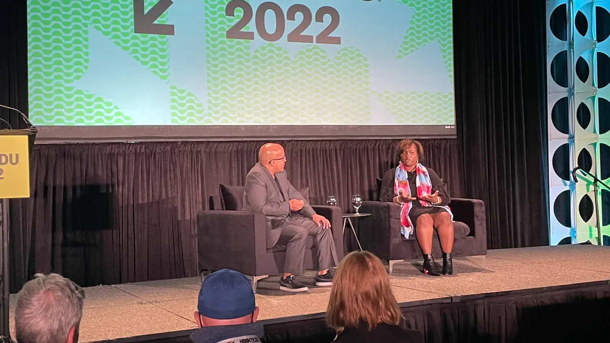 TNTP CEO Taquilla Brownie discusses strategies for disrupting racial inequity in K-12 with Austin Independent School District trustee Kevin Michael Foster at SXSW EDU 2022 in Austin, Texas.