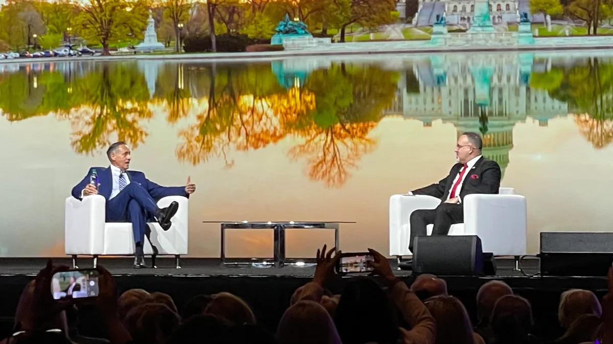 AASA Executive Director Dan Domenech chats with U.S. Secretary of Education Miguel Cardona during a general session at the School Superintendents Association's annual conference in Nashville.