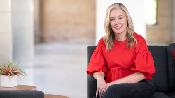 Target's Cara Sylvester in a headshot wearing a red shirt