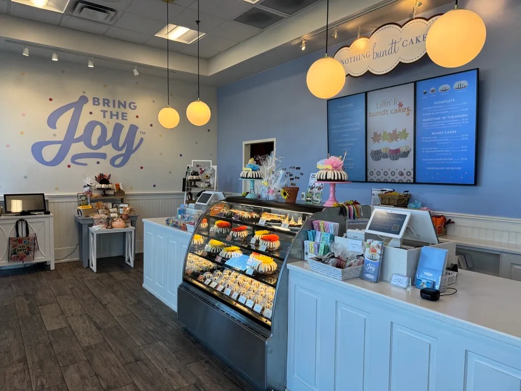 An image of a front counter with bundt cakes in the display case