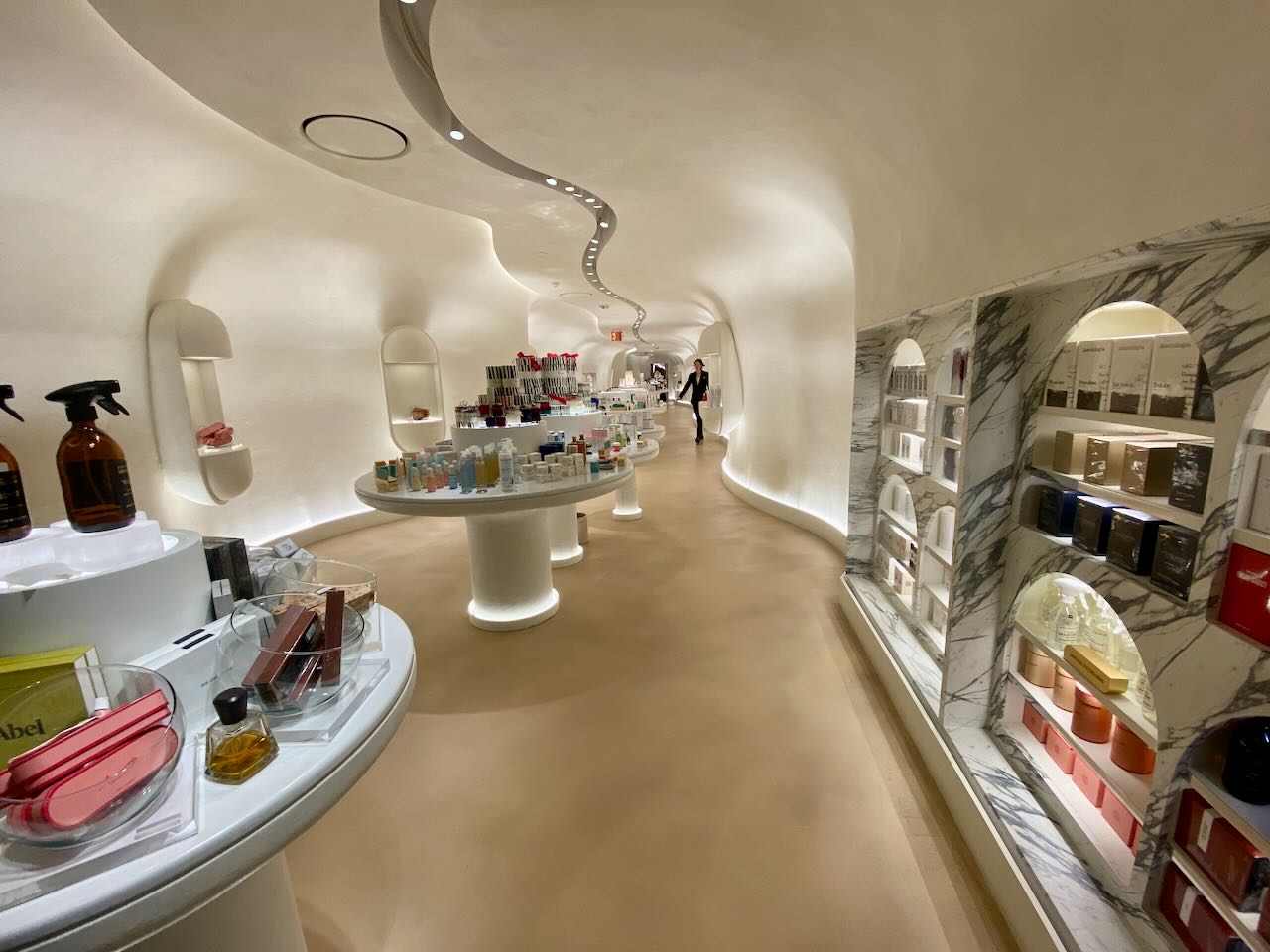 A department store sales floor with wavy architectural elements.