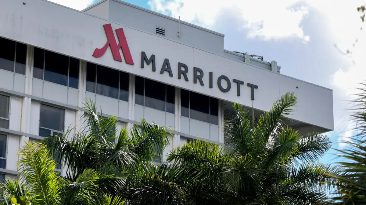 a gray building with signage that reads Marriott