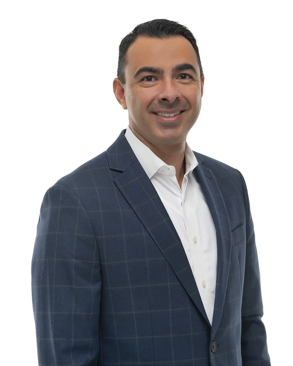 Headshot of man in suit with blank background