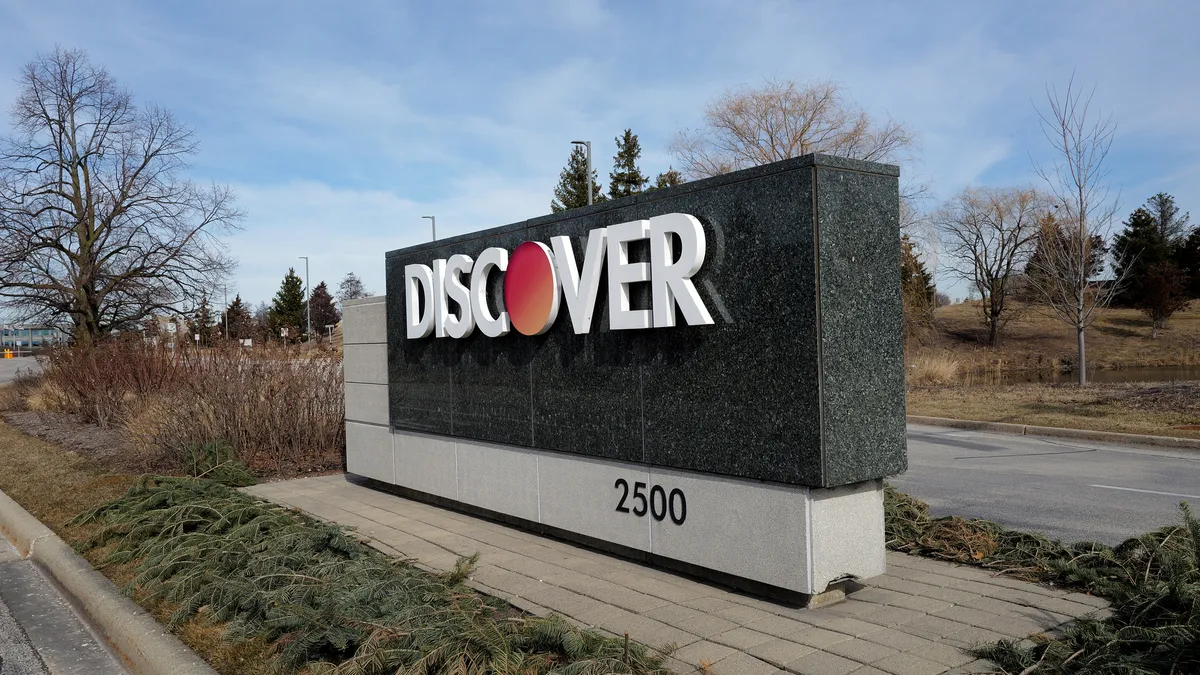 A sign that reads "Discover" marks the entrance to the card company's headquarters in Illinois.