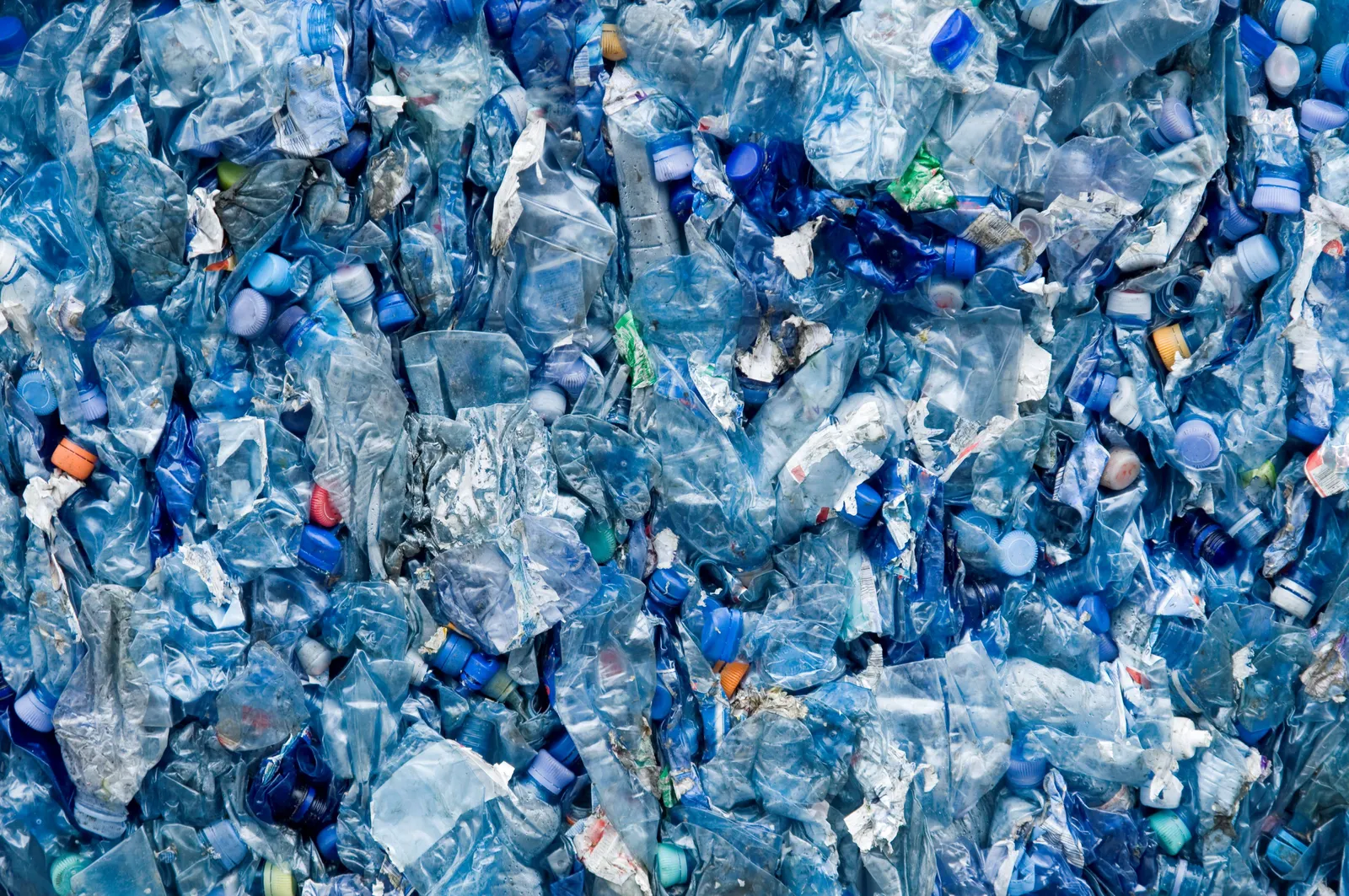 blue plastic bottles crushed together