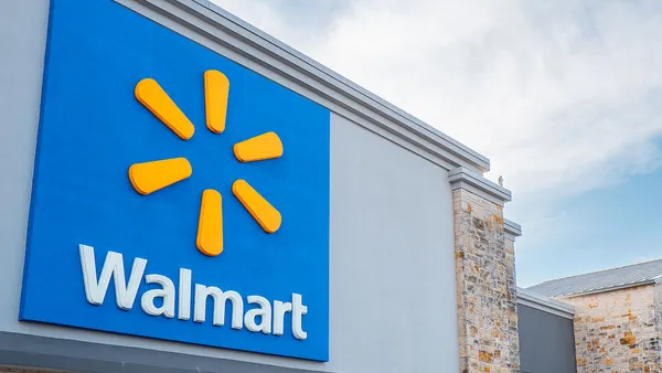a storefront bearing Walmart signage in blue and yellow