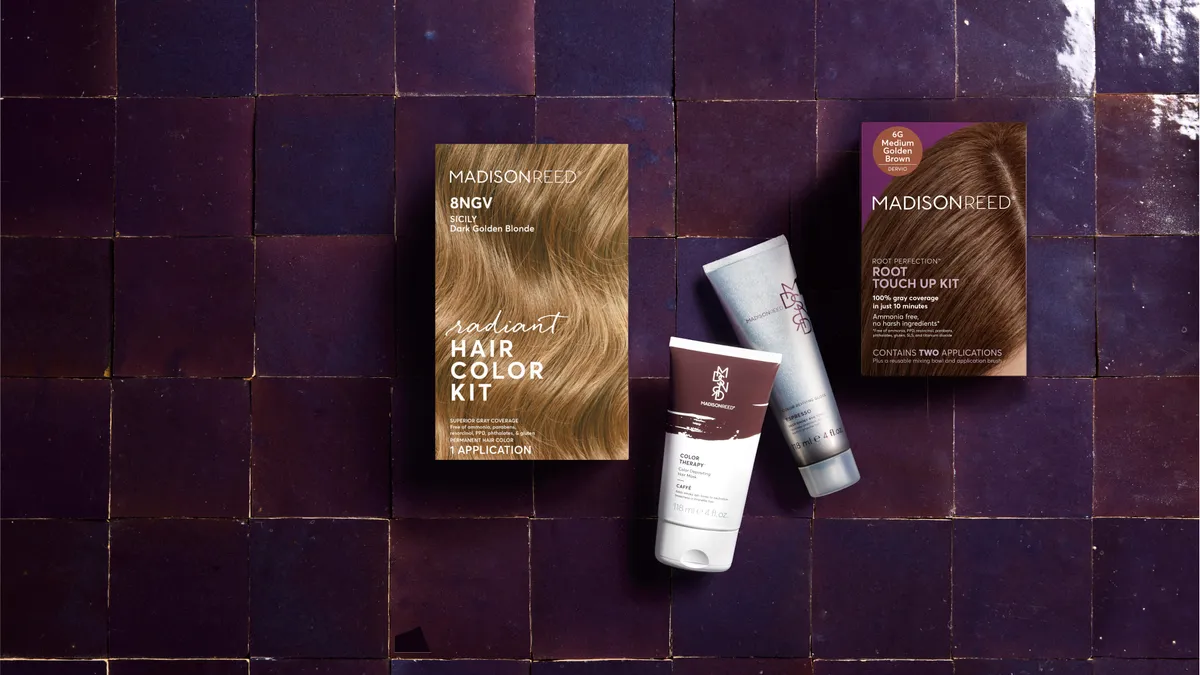 Madison Reed hair color and root touch up boxes against a purple tile background