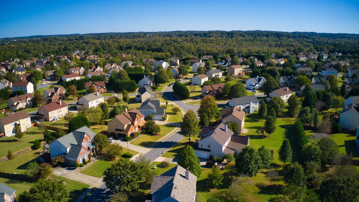 Panoramic aerial view of upscale suburbs in Atlanta during the golden hour.