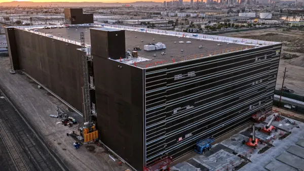 An aerial view of a three-level building under construction