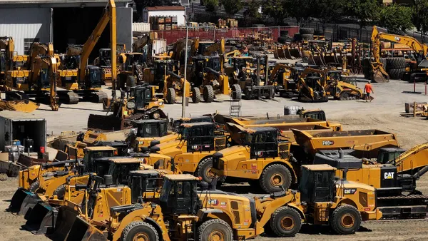 Caterpillar equipment sits in a lot