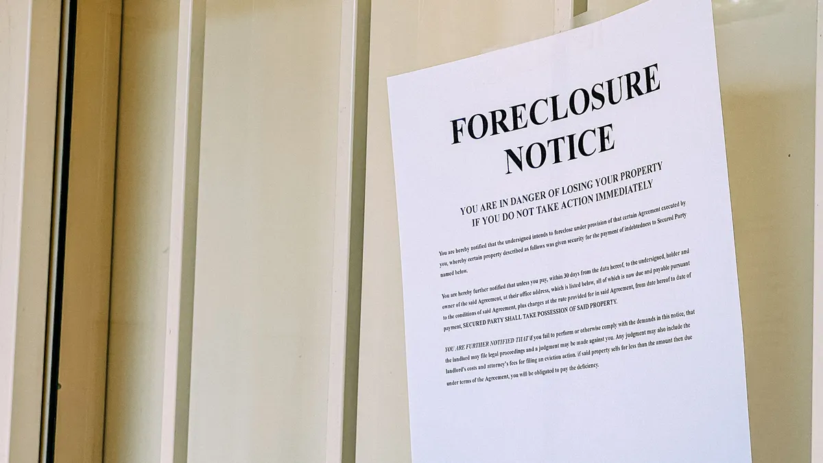 Foreclosure notice posted to a door.