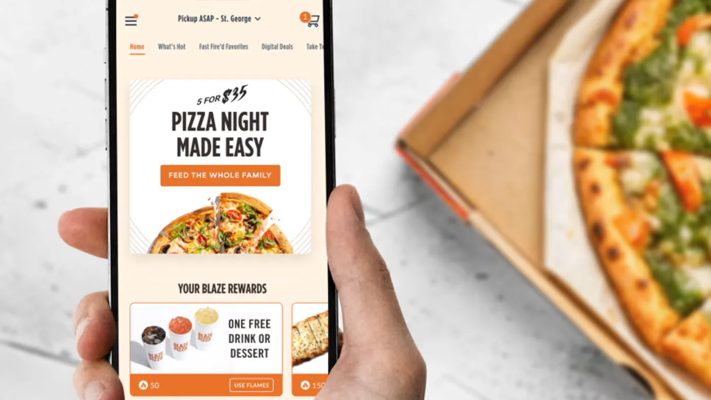 A hand holds a smart phone with a screen that shows a pizza and says 5 for $35 Pizza Night Made Easy