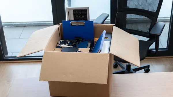 Moving office or home and packing belongings in a box or getting fired