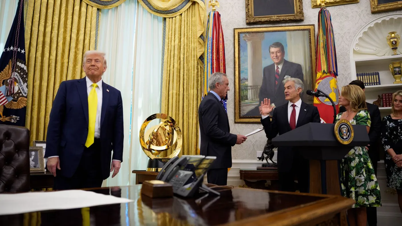 U.S. President Donald Trump watches as Health and Human Services Secretary Robert F. Kennedy Jr. (C) swears in Dr. Mehmet Oz (R) as the Medicare and Medicaid Services Administrator during a ceremony in the Oval Office at the White House on April 18, 2025 in Washington, DC.