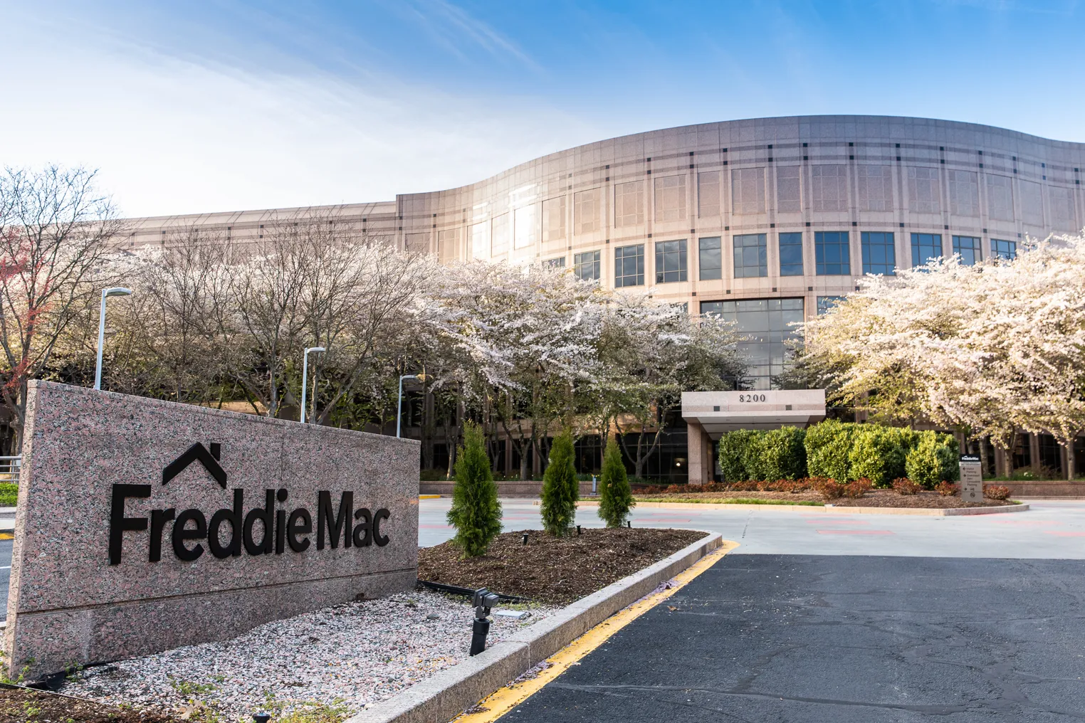 Freddie Mac sign with office building in the background.