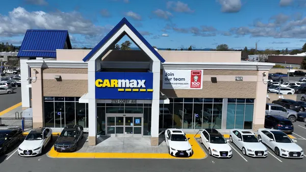 aerial view of cars are displayed on the sales lot at a CarMax dealership