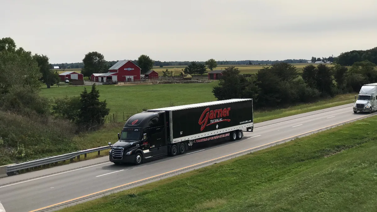 A Garner Trucking truck on a highway.