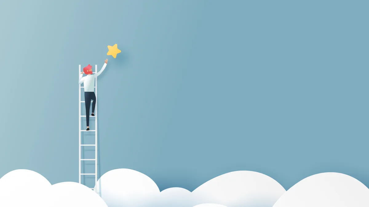 Businessman on a ladder reaching for the star above clouds.