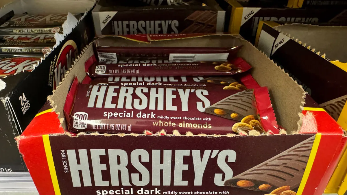 A box of Hershey bars sits in a store.