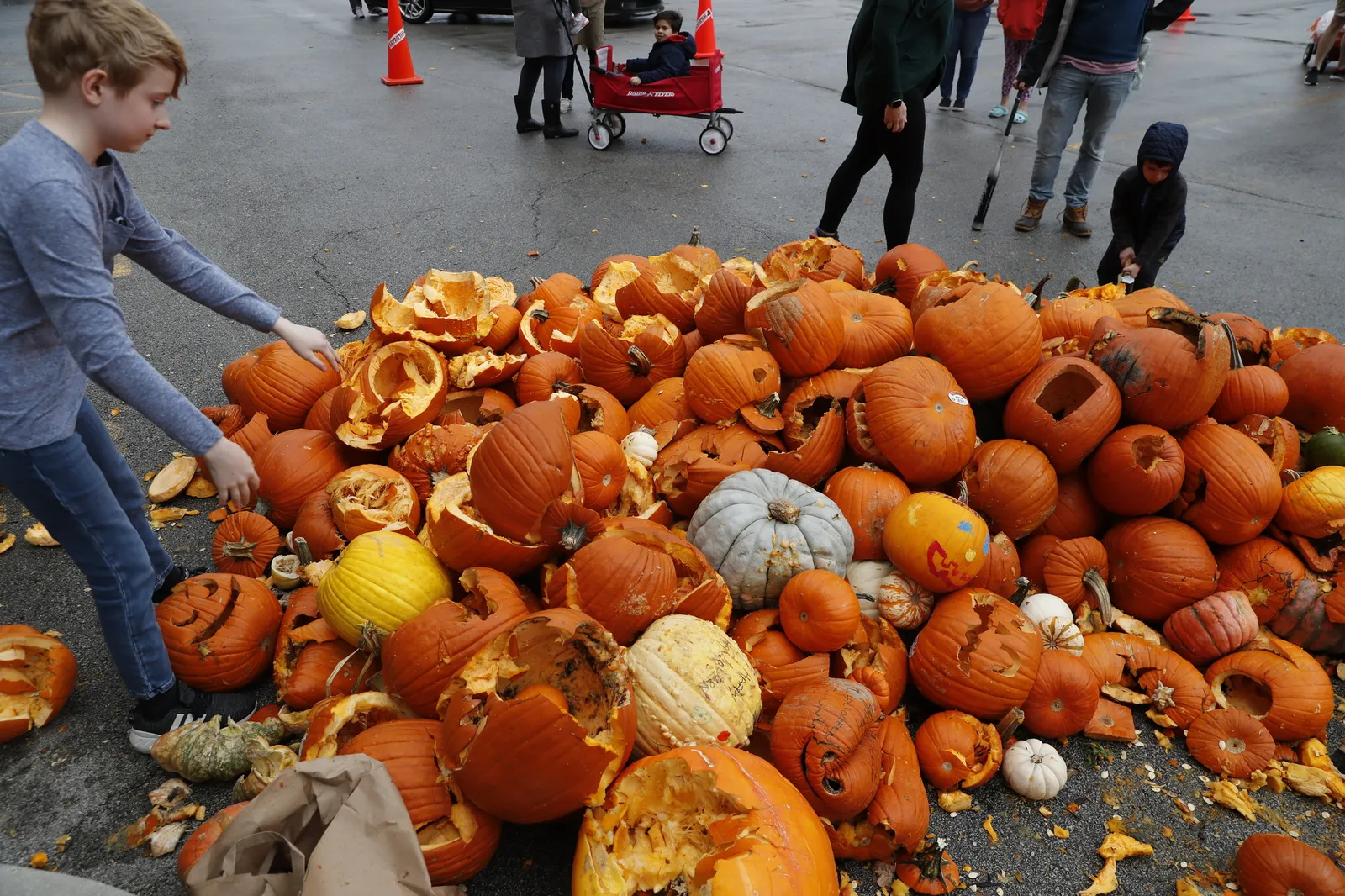 Children smashing pumpkins in Chicago