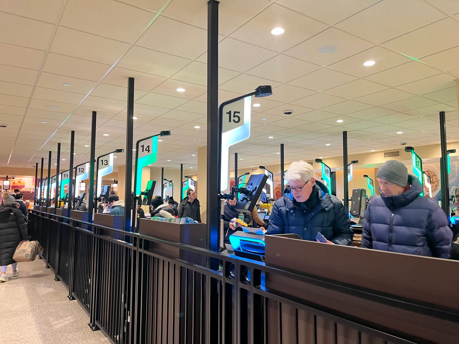 Dozens of self-checkout stations at a grocery store.