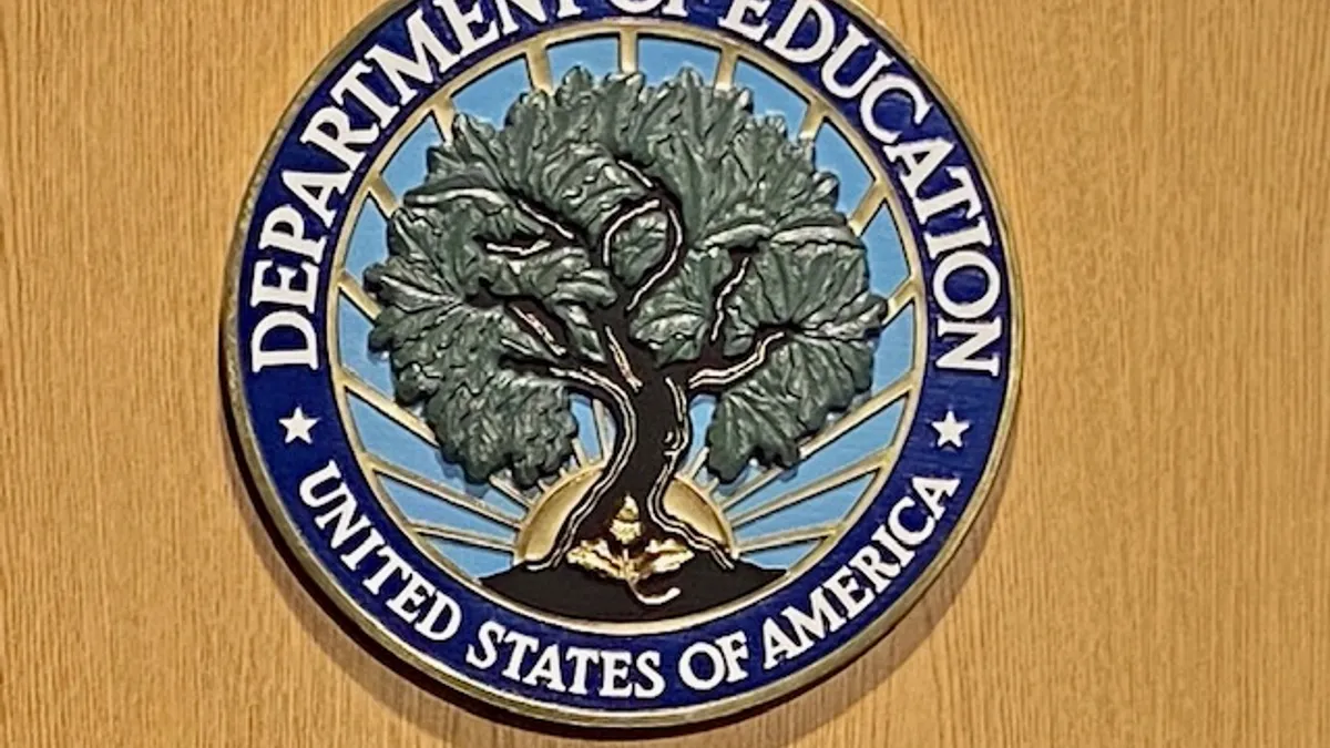 Seal of the U.S. Department of Education on a speaker's podium.