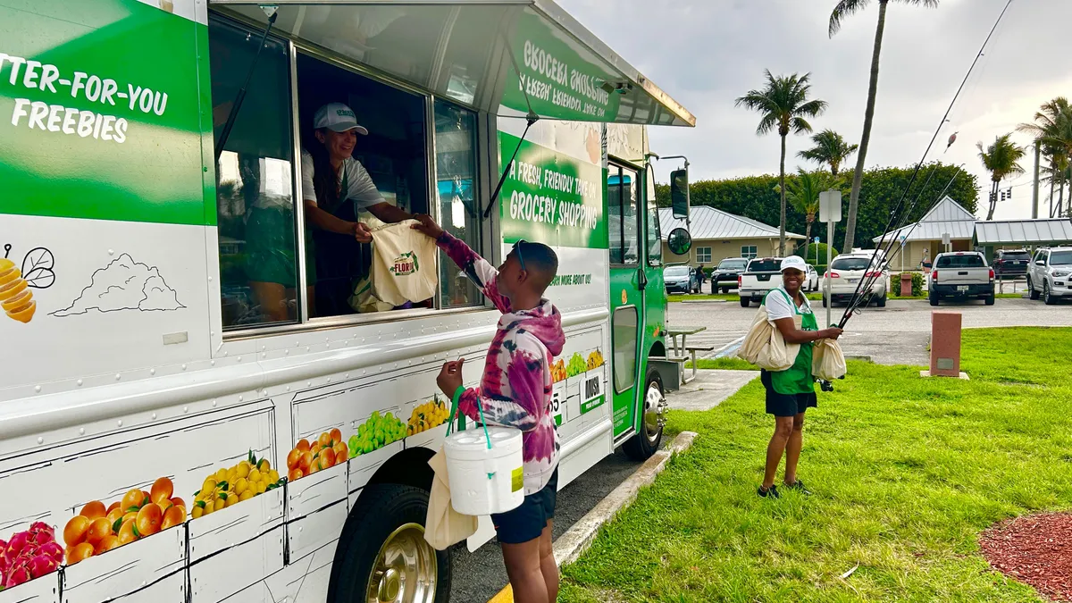 Person buying goods from the Sprouts Mobile Truck