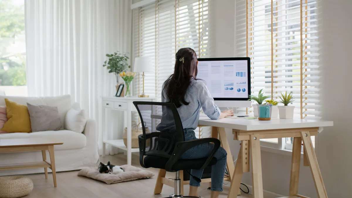 Woman works remotely at home