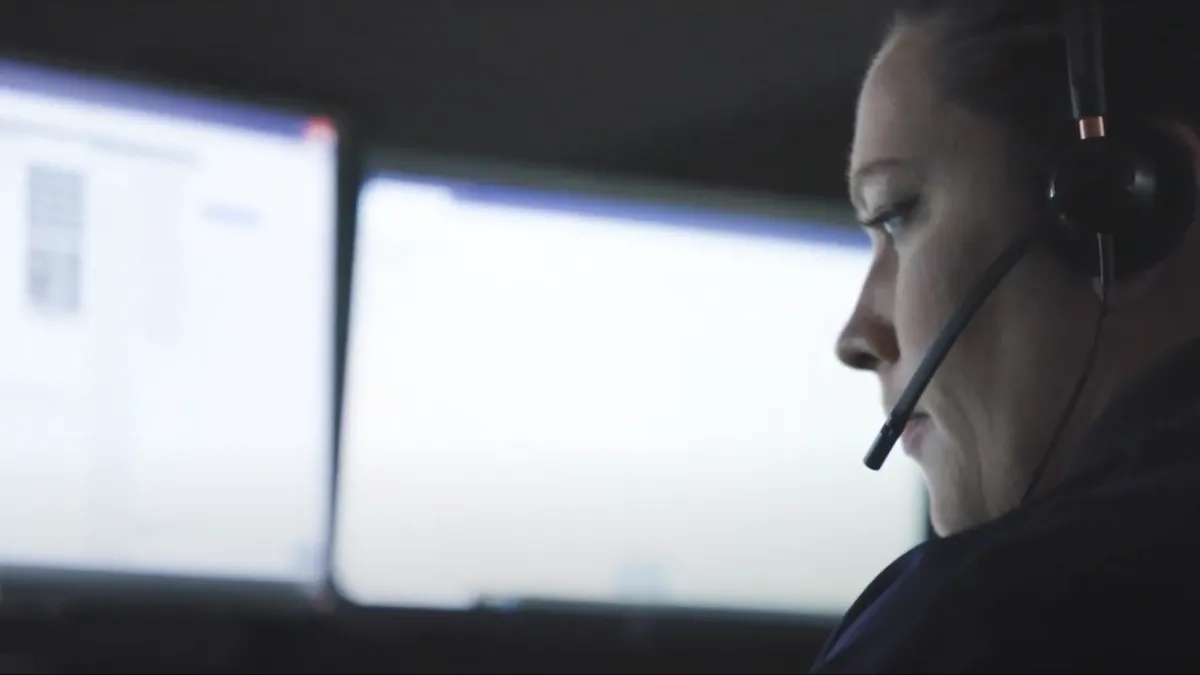 A profile shot of a 911 telecommunicator receiving digital alerts from Emergency24's central station through the RapidSOS portal.