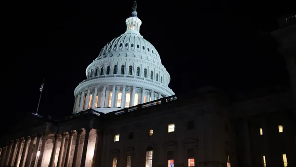 an exterior shot of the capitol building at night