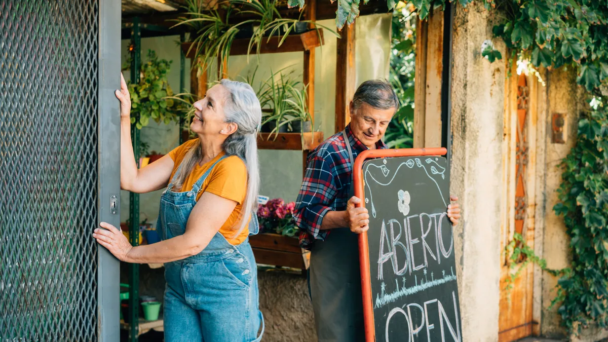 Two people open flower shop