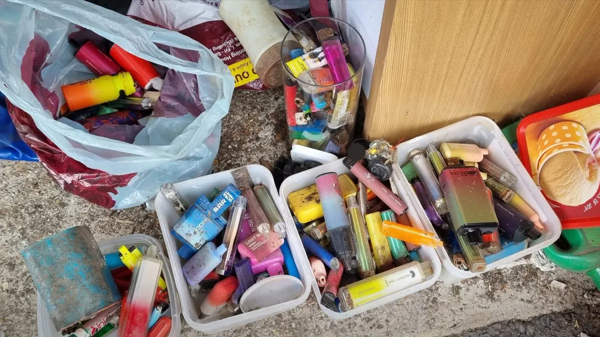 an overhead view of boxes of used vapes awaiting recycling