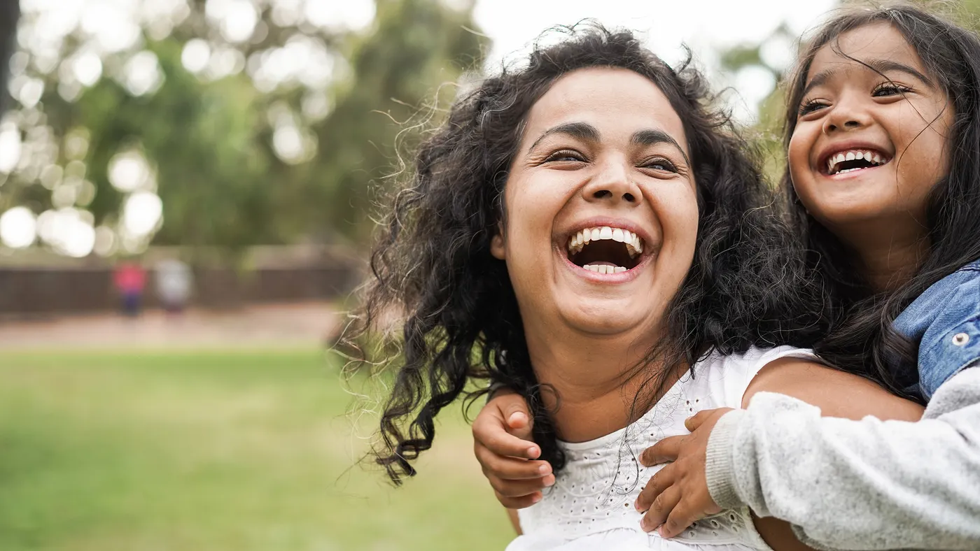 MOther and child smiling and laughing