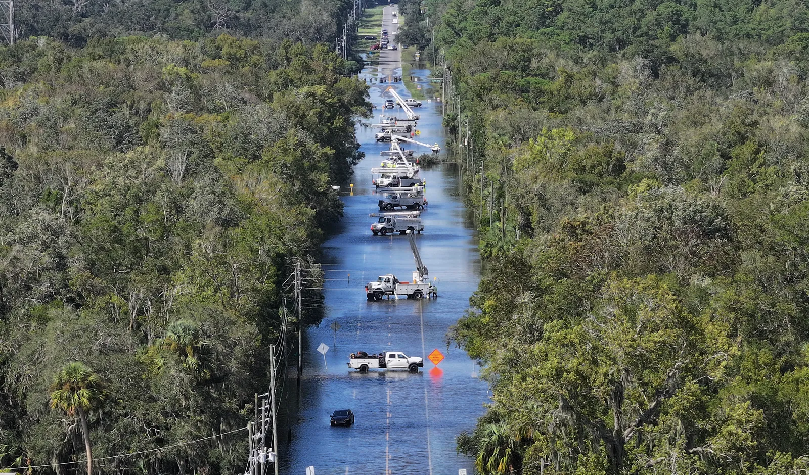 Power crews work on the lines after Hurricane Helene