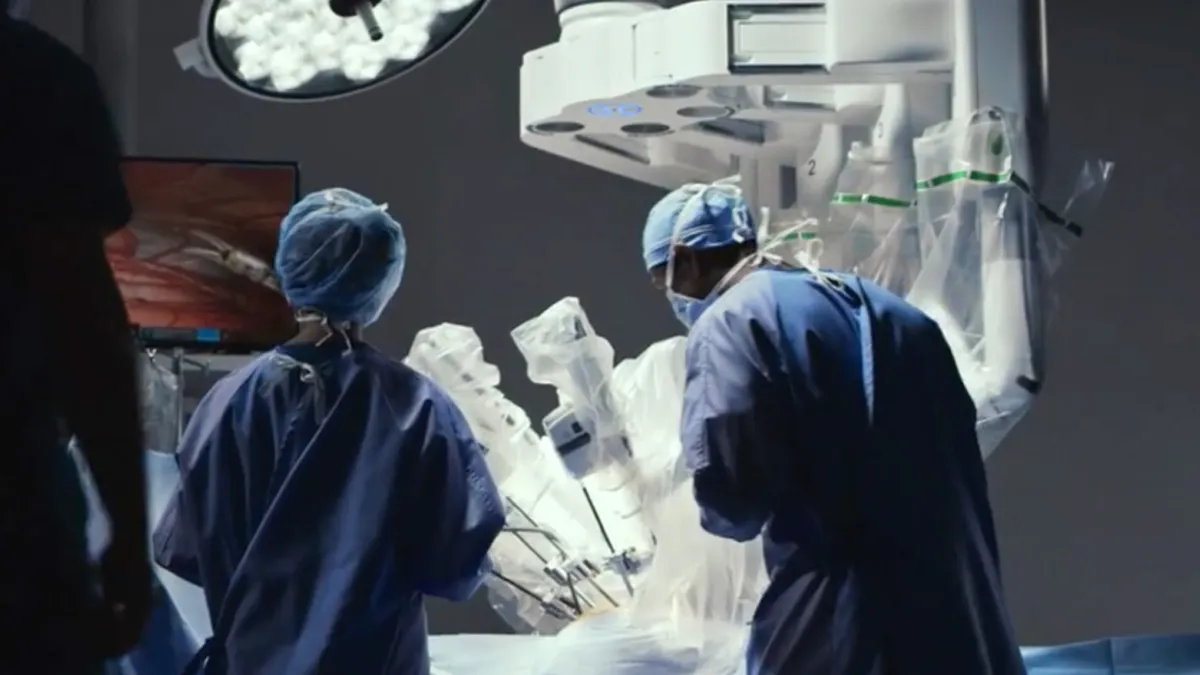 A surgeon using a davinci intuitive robot