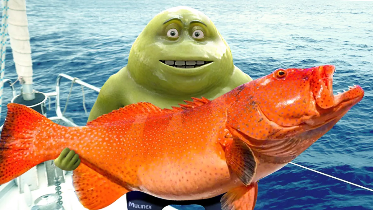 Mr. Mucus holds a fish in a Mucinex ad