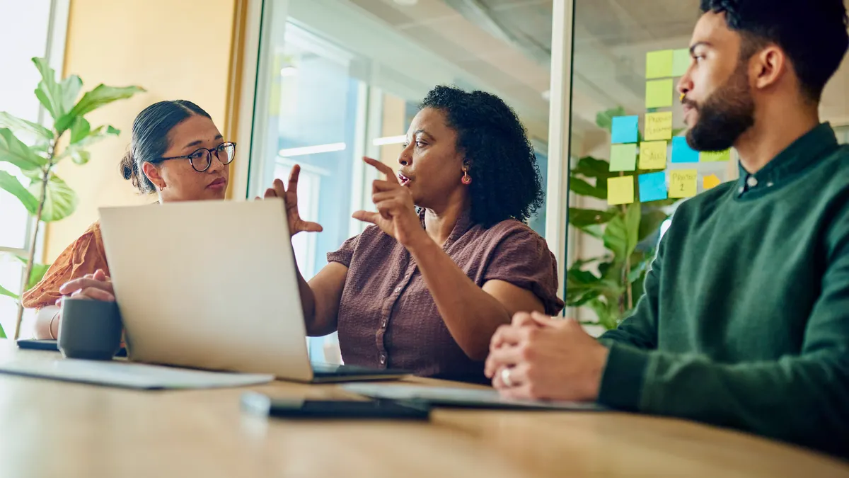 Professionals Brainstorming Ideas In Modern Office