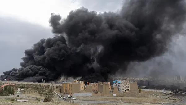 smoke rising from oil depot fire