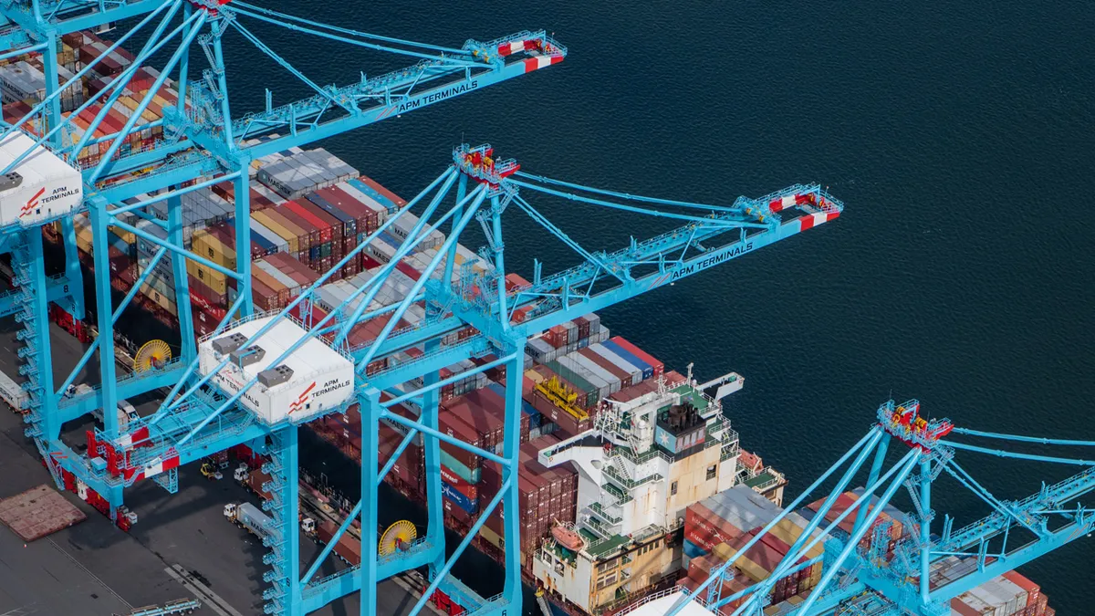 An air view a container vessel docked at a water port