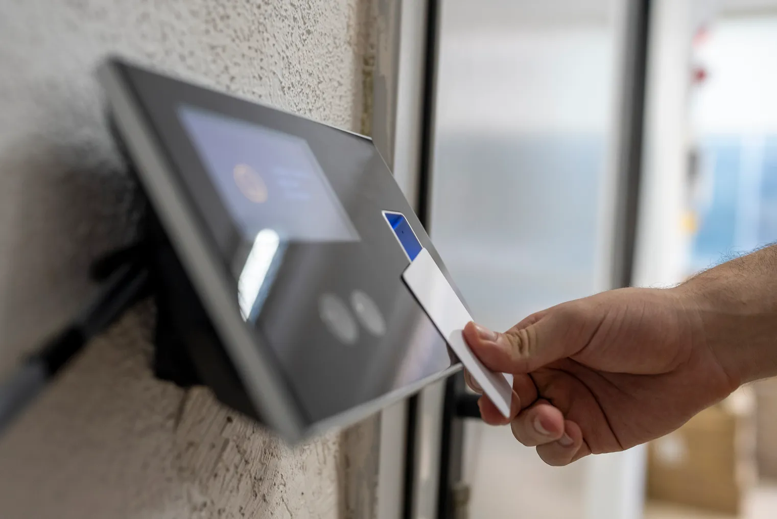 A vendor scans a security card to enter a facility.