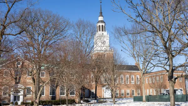 A daytime view of the Dartmouth College campus with snow in the foreground