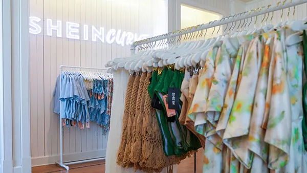 A Shein store is pictured, with a rack of clothes on display.
