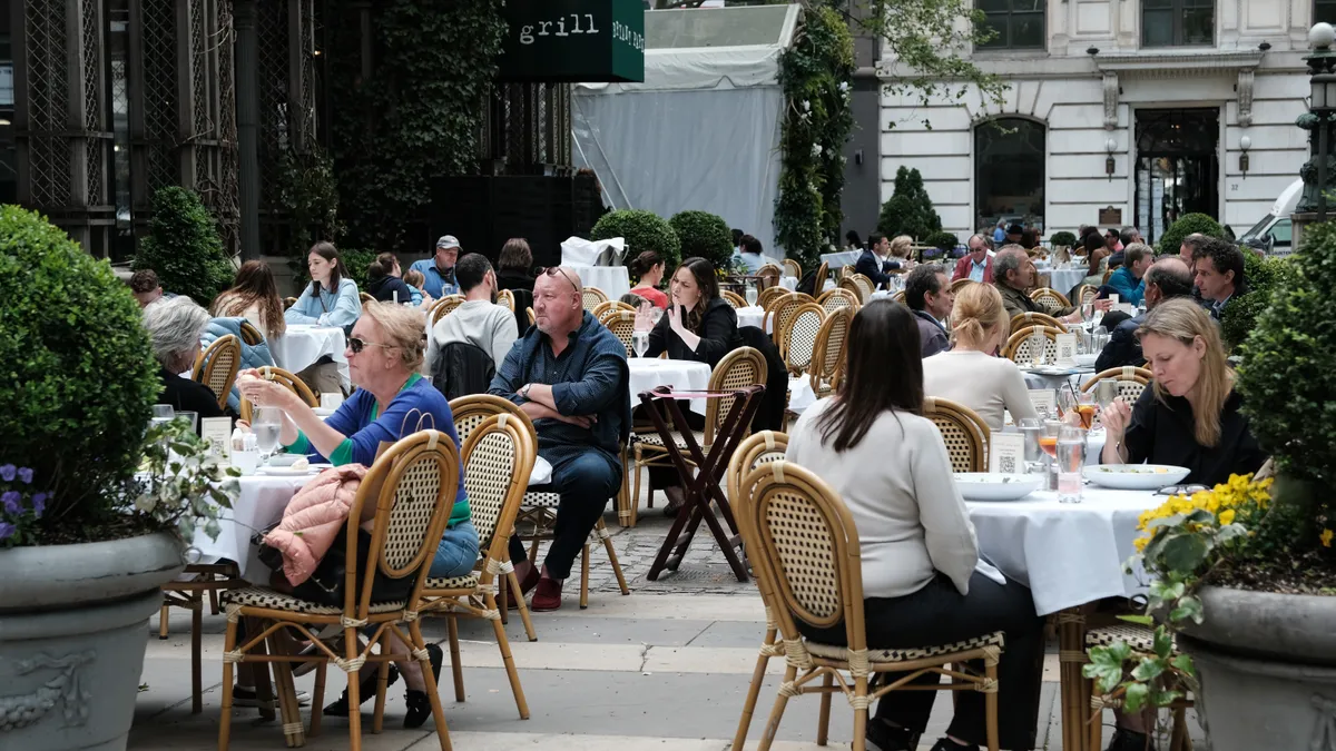 Restaurant diners eat outside