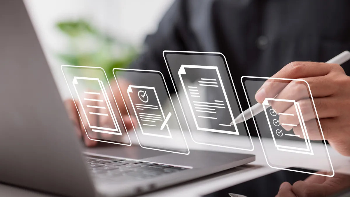 Paperless workplace idea, e-signing, electronic signature, document management. Businessman signs an electronic document on a digital document on a virtual notebook screen using a stylus pen